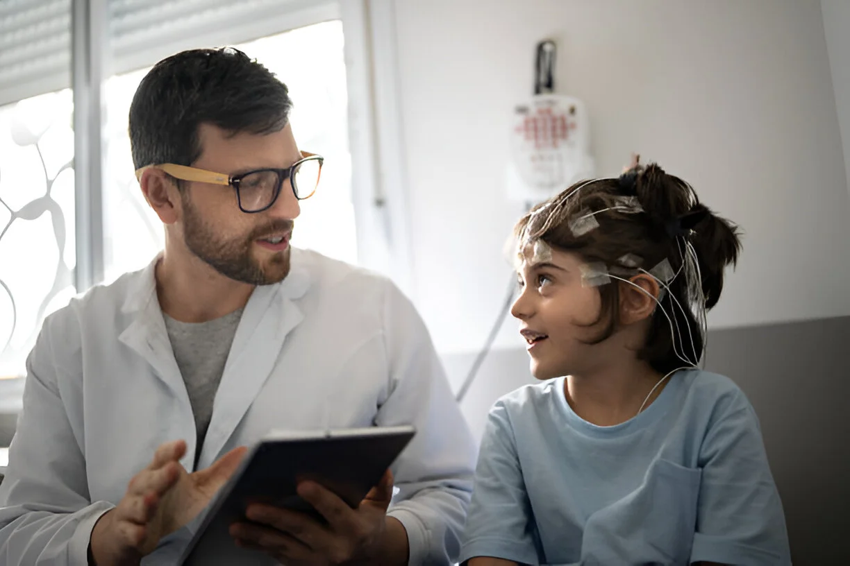 Doctor with young patient during brain analysis session